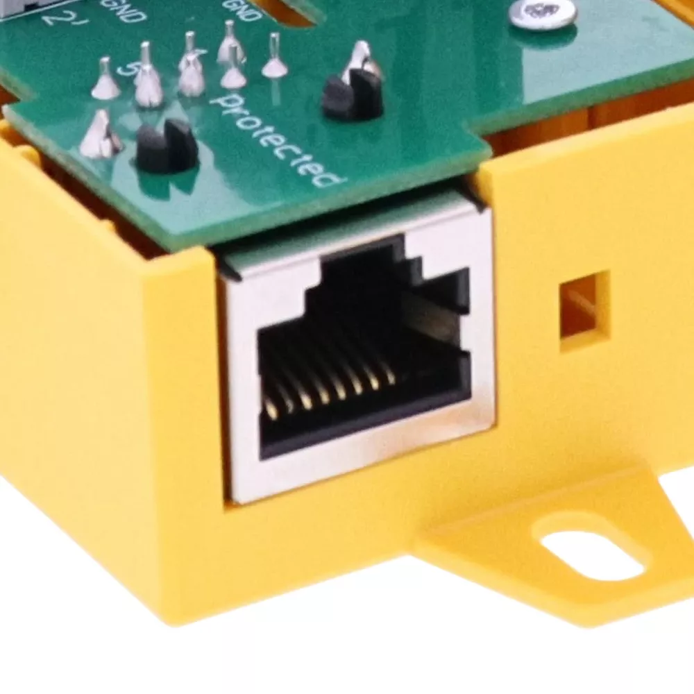 Close-up of an RJ45 Ethernet port on a yellow DEHNbox circuit module.
